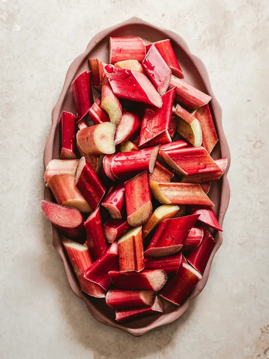 Chopped pink rhubarb in a shallow dish
